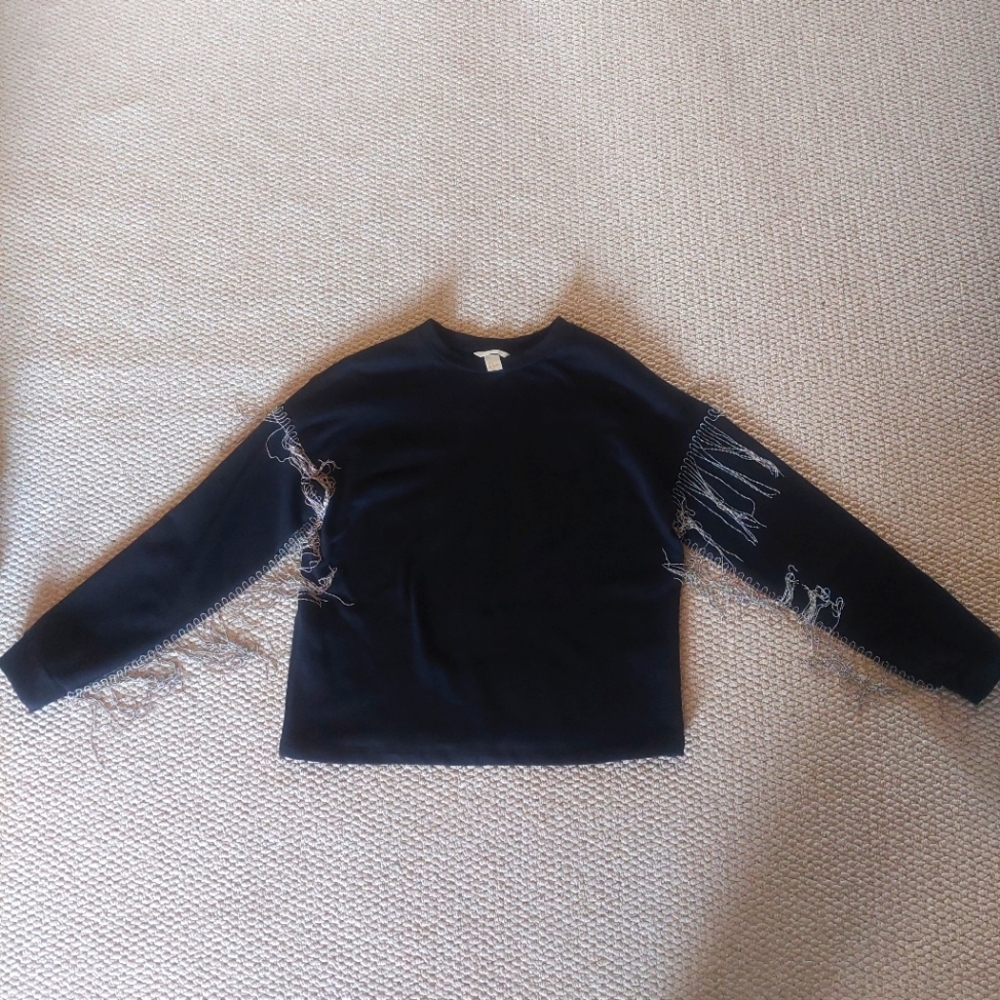 Designer black tassel sweater from H&M